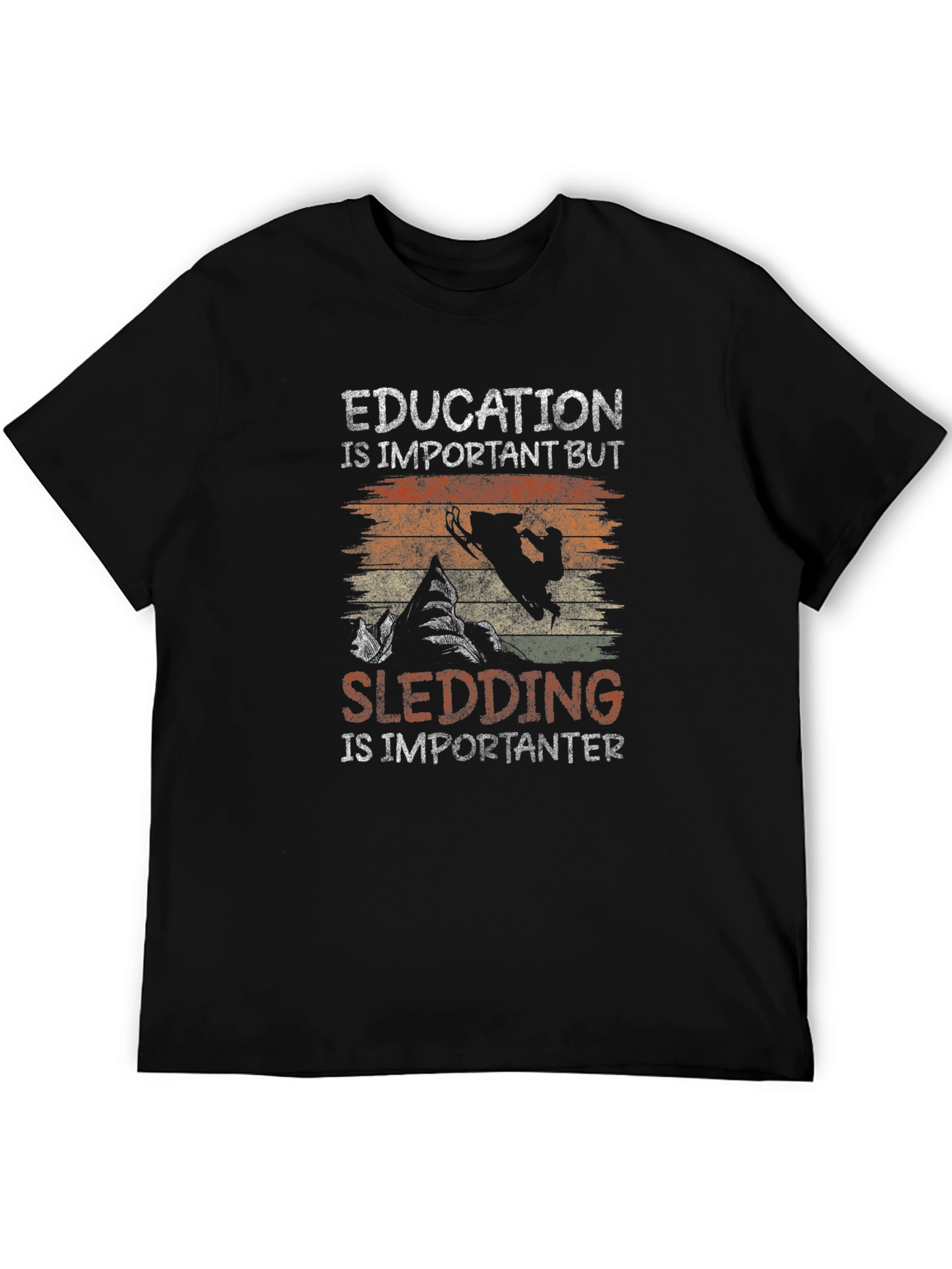 Education Vs Sledding Graphic Tee