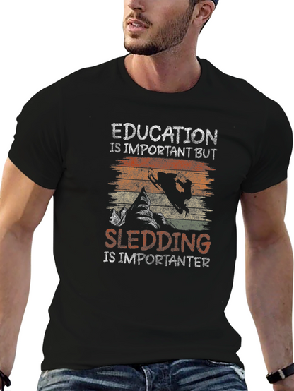 Education Vs Sledding Graphic Tee