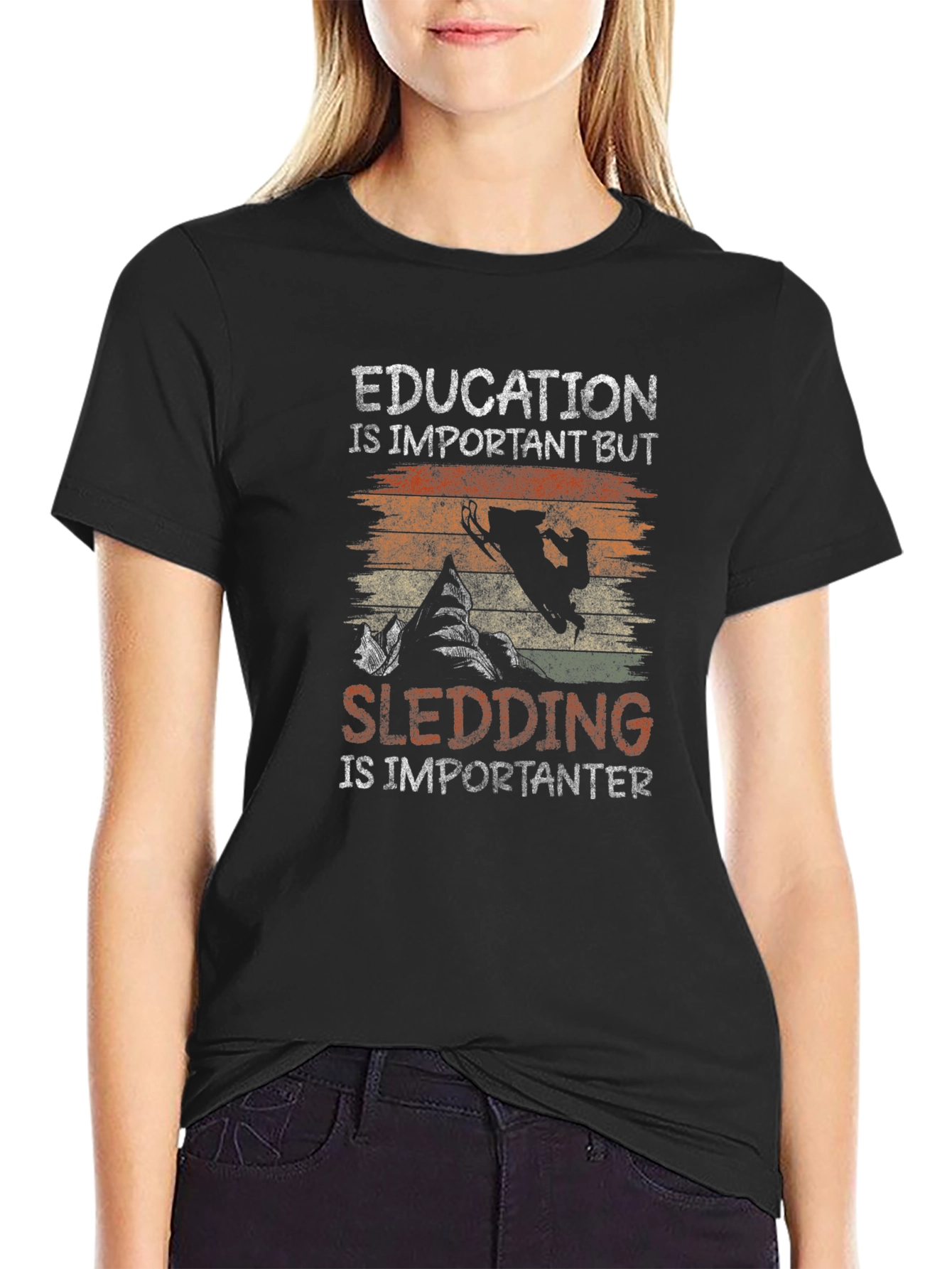 Education Vs Sledding Graphic Tee