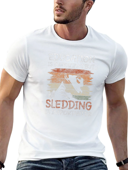 Education Vs Sledding Graphic Tee